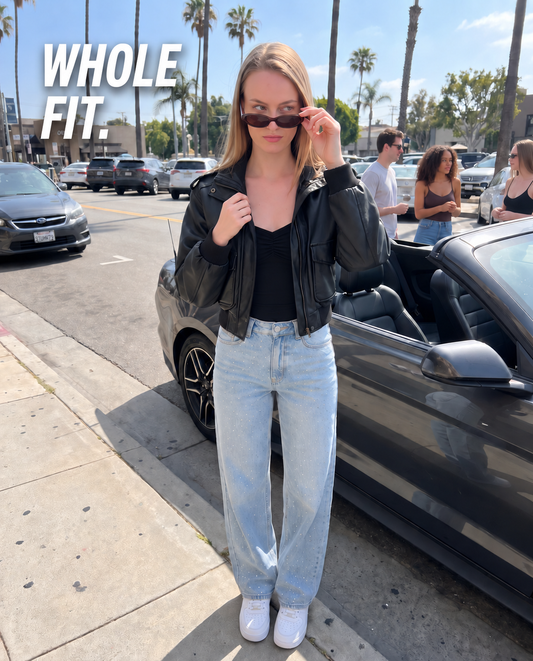 The Statement Fit — full-length black Remi cami, light wash Stella jeans and black Marlowe bomber.